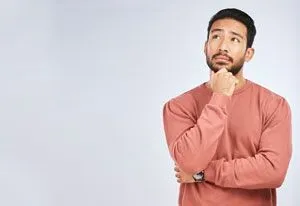 Man thinking while staring off to the right