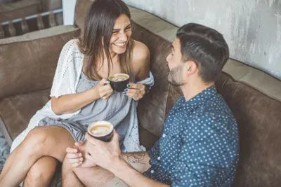 Man and woman enjoying cups of coffee on a casual date