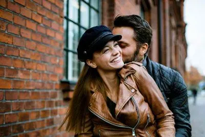 Couple smiling and hugging in NYC