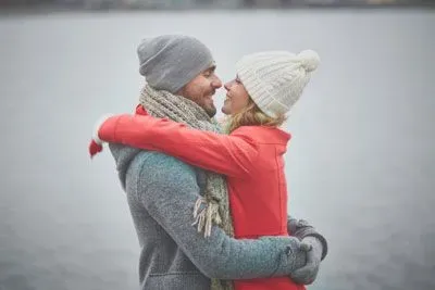 Couple embracing outside on a cold day