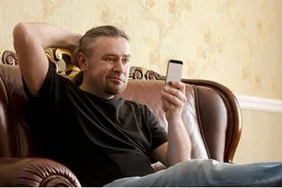 Man looking puzzled at his cell phone
