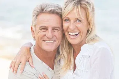 Couple in their 50s embracing